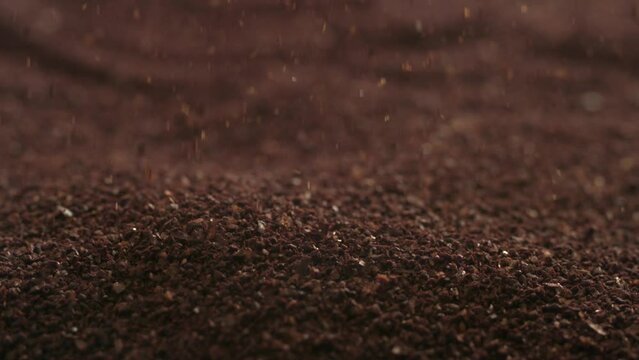 Ground coffee falling in slow motion
