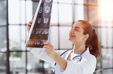 Brain disease diagnosis with medical doctor diagnosing elderly ageing patient