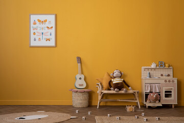 Warm and cozy composition of child room interior with mock up poster frame, children kitchen, braided bench, basket, guitar, bear carpet, wooden blocks and personal accessories. Home decor. Template. - obrazy, fototapety, plakaty