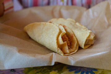 Tacos on waxed paper. Typical Mexican food.
