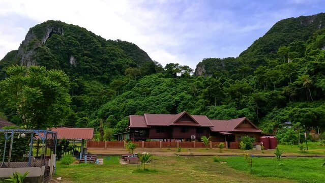 Phi Phi island off the coast of phuket thailand. Phi phi island is famous for turquoise clear blue waters teaming with Corel reef fish white soft sand and lush green trees.