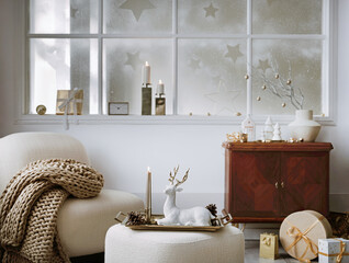 Cozy and stylish christmas living room interior with design armchair, retro shelf, poufm big...