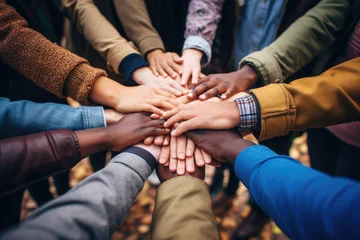 Tuinposter Group of mix race people joining hands together in a circle supporting each other, symbolizing unity and collective action in the fight against social injustice © Jasmina