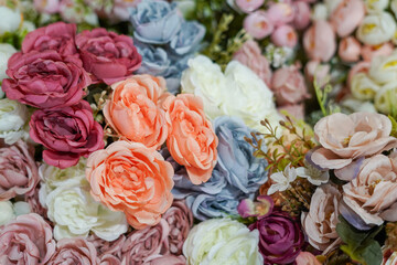 Bouquet of artificial flowers. Flower texture background for wedding scene. Banner for website