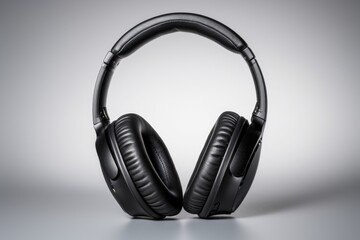 Fototapeta na wymiar noise-cancelling headphones on a neutral light background
