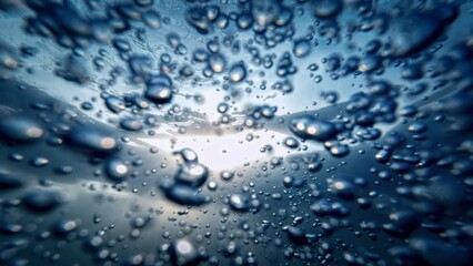 Air bubbles rising up from the ocean depths to the water surface, complemented by the gentle sunlight. Perfect for an abstract natural background