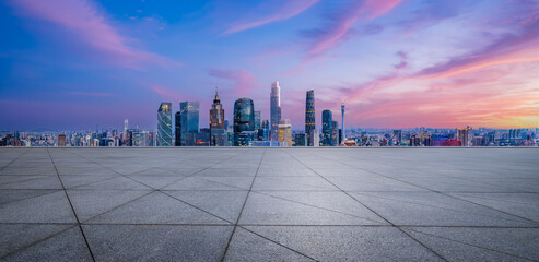 Empty square floor and Guangzhou skyline with modern buildings at sunrise, Guangdong Province, China. Panoramic view. - obrazy, fototapety, plakaty