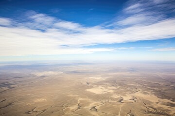 Fototapeta na wymiar high altitude shot of wind farm on a windswept plain