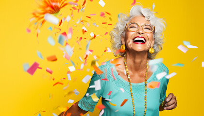 happy smiling portrait of an old woman with colorful confetti