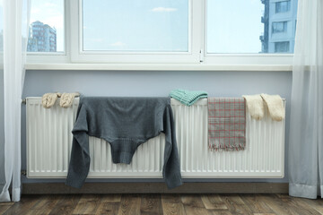 Clothes are dried on the radiator after washing