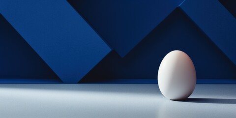 A white egg sits on a blue and red floor.