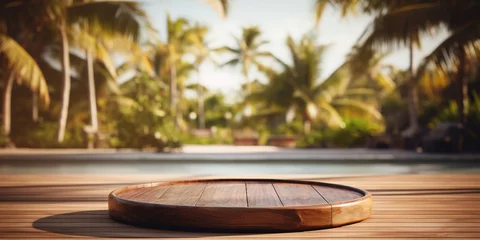 Deurstickers Empty round wooden podium on wooden table opposite tropical spa resort background with palm trees. © Svitlana