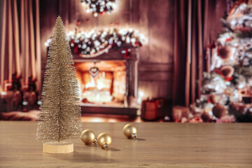 Desk of free space and christmas balls decoration. Home interior with fireplace and christmas tree. 