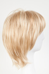 Naklejka premium Natural looking blonde fair wig on white mannequin head. Short hair cut on the plastic wig holder isolated on white background, side view.