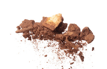 Cocoa powder fall fly in mid air mix cookie cracker, Cocoa powder floating explosion. Cocoa powder Chocolate chip crunch throw in air. White background isolated freeze motion high speed shutter