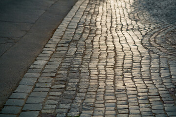 Stone pavement in perspective. Artistic texture and background. Element of the old street of the...