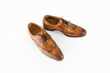 Leather men's shoes. handmade. Classic shape and pattern. Brown. Isolated on white