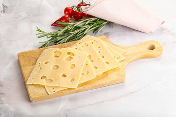 Sliced maasdam cheese with holes