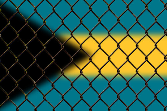 A steel mesh against the background of the flag Bahamas.