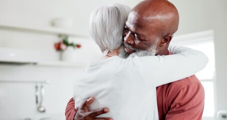 Interracial, happy couple and hug with love and support at home, comfort with empathy or hello with old people. Retirement, life partner with black man and woman in marriage with embrace in kitchen