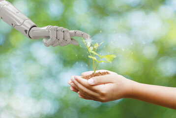 Earth Day, Hands holding trees growing with a robotic hand touching the tree collaboration between humans and technology to protect the environment