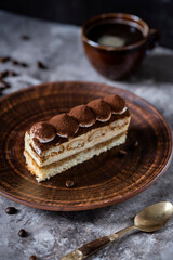 Italian dessert tiramisu close-up. Low key,
