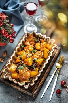 Christmas dinner, baked potatoes with dried fruits, New Year, Festive dinner. New Year's dish.