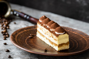 Italian dessert tiramisu close-up. Low key,