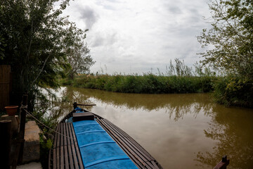 barge moored in the port of La Albufera on a gray day