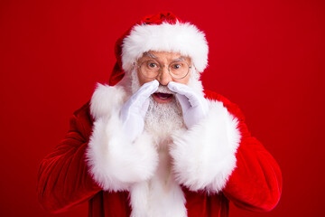 Photo of fairy personage santa claus wear white gloves hands touch face announce new year sale isolated on red color background