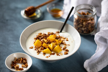 Homemade yogurt with granola and mango