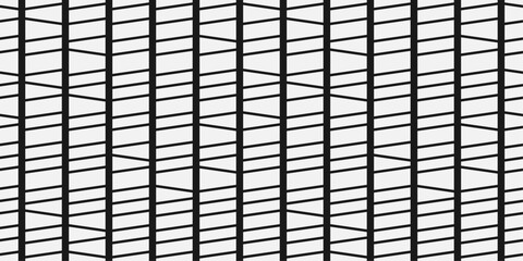 Seamless pattern of columns divided diagonally along their entire length. Abstract monochrome and stylish pattern.