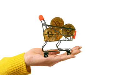 golden bitcoins in shopping cart on hand isolated on transparent background,, cryptocurrency purchase concept