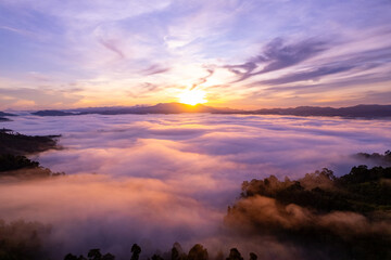 Amazing Sunrise or sunset over mountains hills covered with mist, Aerial view landscape drone shot...