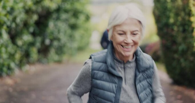 Senior, fitness and couple of friends running in a park happy, playful and competitive outdoor. Cardio, sports and elderly people in a forest for training, chasing and fun on nature workout together