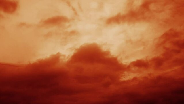 Fiery clouds speeding overhead.
Cloud timelapse with a red tint.