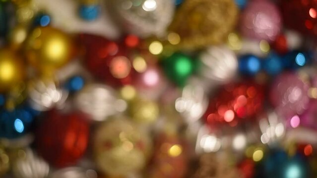 Colorful christmas ornaments background from above. Bokeh new year and xmas decoration glittering and shining. Top view.