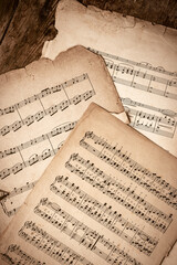 Old Music Sheets On Wooden Background