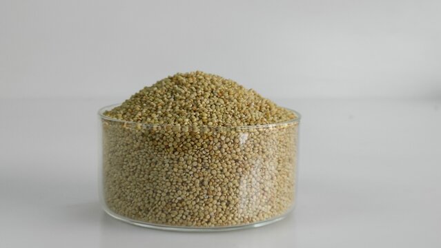 Closeup of browntop millet grains in a glass bowl