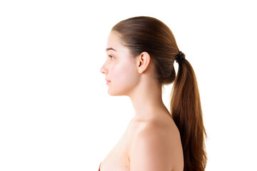 Side view portrait of young woman with naked shoulders and well-kept smooth skin. Beauty face, clean, fresh, smooth skin. Skin care procedures.