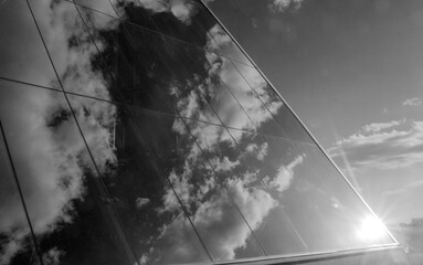 Glass wall of a business center modern background, urban architecture black and white abstract photo - obrazy, fototapety, plakaty