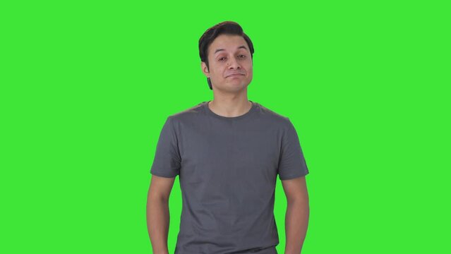 Happy Indian man showing thumbs up Green screen