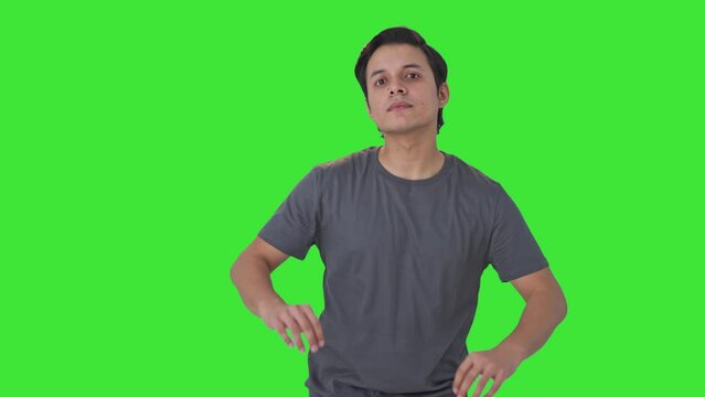 Happy Indian man getting ready Green screen