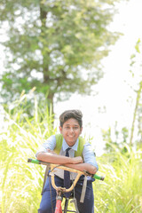 Young indian boy riding a bike