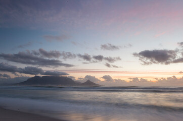 long exposure capture of the Table Mountain and Lion's head from Blouberg Beachfront, Western Cape, South Africa,