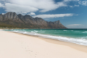 Fototapeta na wymiar white sand beach and turquoise ocean in Helderberg rural area near Gordons Bay, Western Cape, South Africa