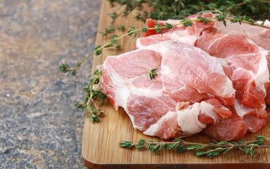 raw organic lamb meat on wooden board