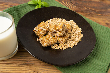 Sunflower Seeds Bar on Black Plate, Energy Snack with Honey, Sun Flower Seed Muesli Dessert