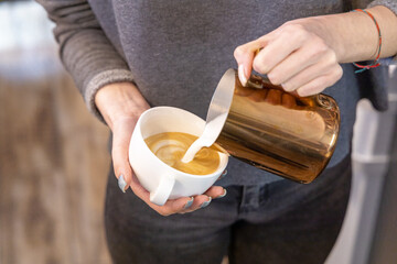 Barista coffee service concept.Barista women using coffee machine to make coffee in cafe
