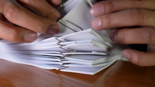 Closeup hand arranging paper work sets using as business and education concept